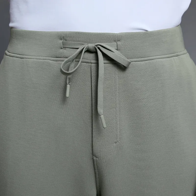 MZ-MWP002 | Wholesale Men's Joggers: 300G Brushed Air-Layer Fabric & Secure Back Zip Pocket - Iron Mountain Green - muzyoga 3 Detailed view of the adjustable drawstring elastic waistband.
