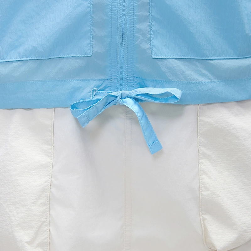 MZ-006 | Wholesale Ultra-Light Packable Sun Jacket: 25G Crinkled Nylon & Water-Repellent - Bluebell - muzyoga 6 Detailed view of the adjustable drawstring hem for a custom fit.