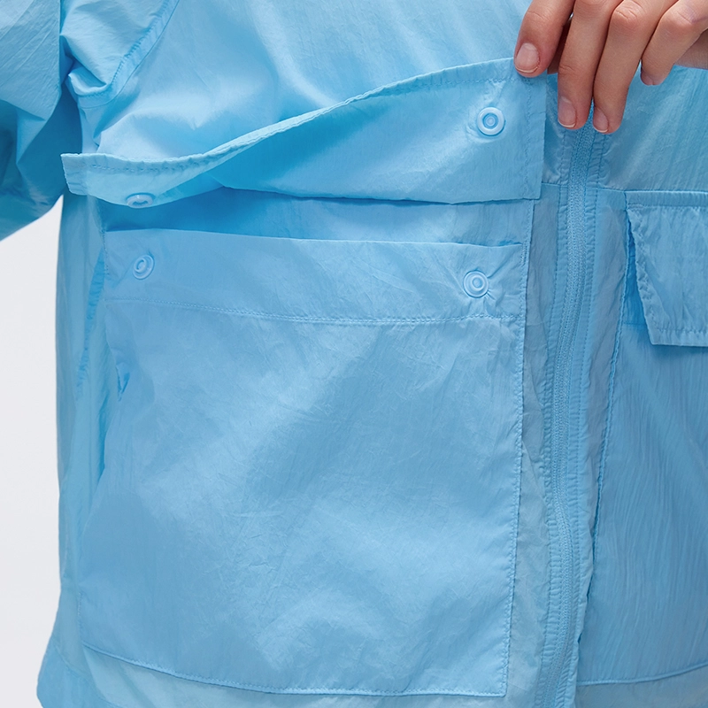 MZ-006 | Wholesale Ultra-Light Packable Sun Jacket: 25G Crinkled Nylon & Water-Repellent - Bluebell - muzyoga 4 Detailed view of the convenient dual-opening pocket system.