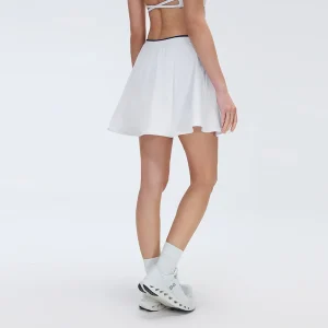 Rear view of MZ-010 highlighting the flattering fit and clean white aesthetic.