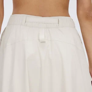 Rear view of MZ-048 highlighting the structured midi silhouette.