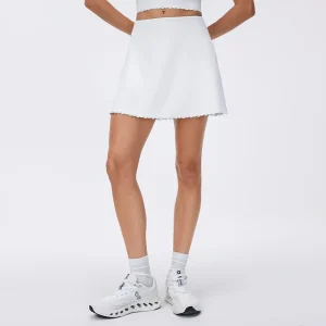 Custom OEM/ODM Solution 7 Front view of MZ-090 White high-waisted seamless tennis skirt with scalloped hem.