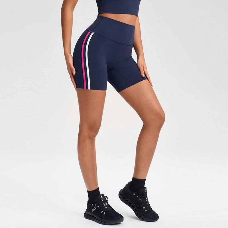 MZ-1002 | Wholesale High-Waisted Athletic Shorts: No-Front-Seam & Contoured Lines - Navy Blue - muzyoga 4 Alternative side angle of MZ-1002 emphasizing zero-restraint stretch.