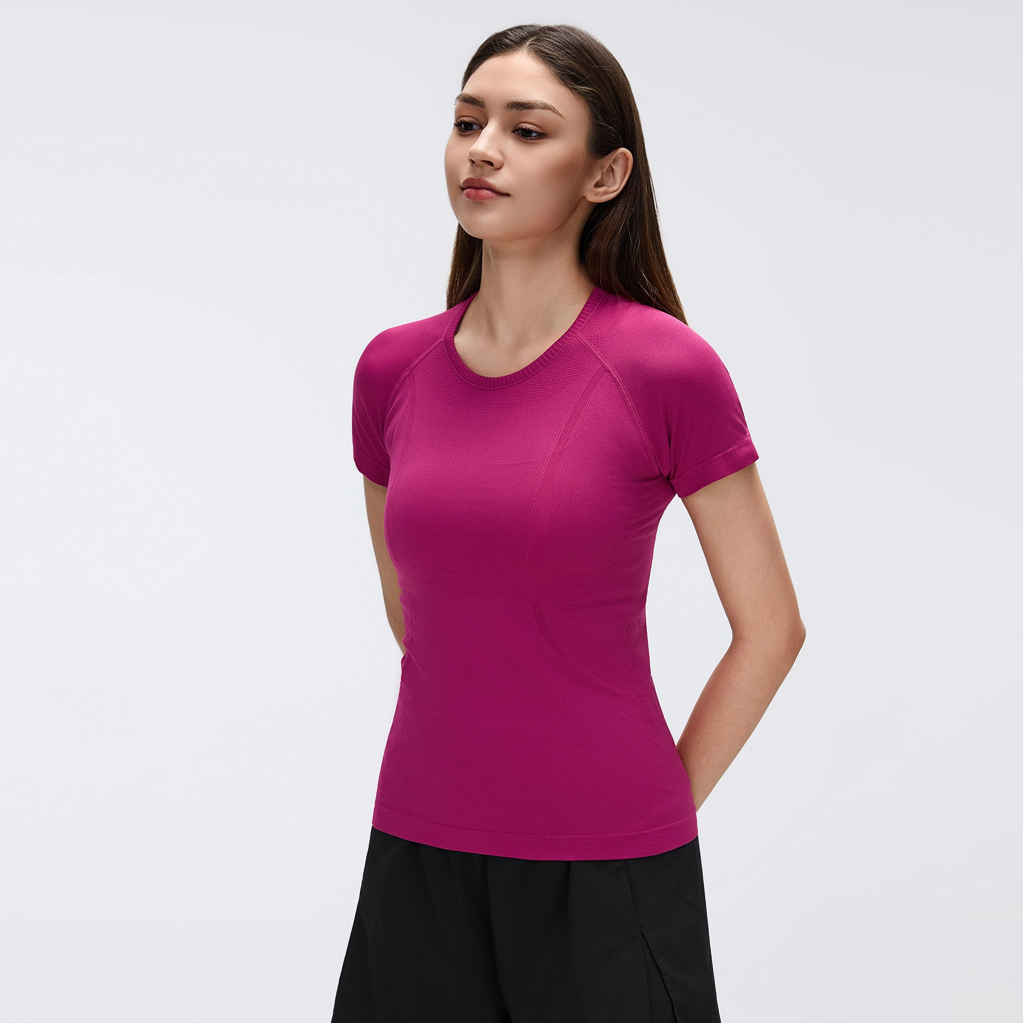 MZ-2067 | Wholesale Seamless Performance Tee: 160G Breathable Nylon & Back Ventilation - Smoky Magenta - muzyoga 3 Side profile view showing the seamless body-contouring fit.