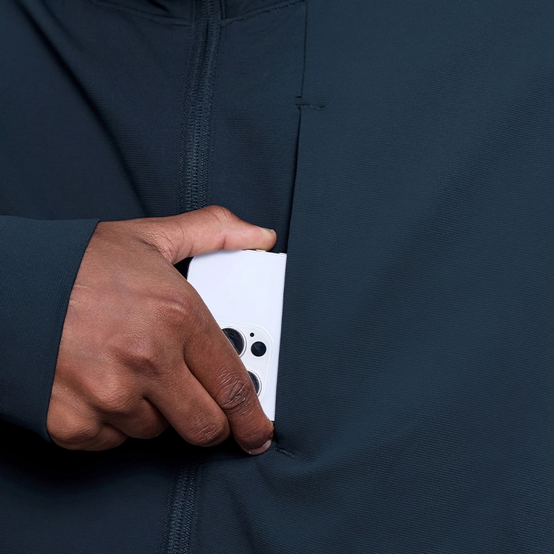 MZ-MJ001 | Wholesale Men's Full-Zip Performance Jacket: 200G Fine-Ribbed Tech Fabric & Secure Zip Pockets - Deep Sea Blue - muzyoga 4 Close-up of the secure chest zipper pocket for anti-theft storage.