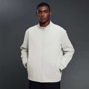 Front view of men's Bone White jacket with hands in pockets.