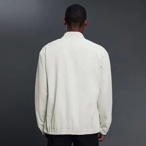 Back view of MZ-MJ003 men's training jacket in bone white.