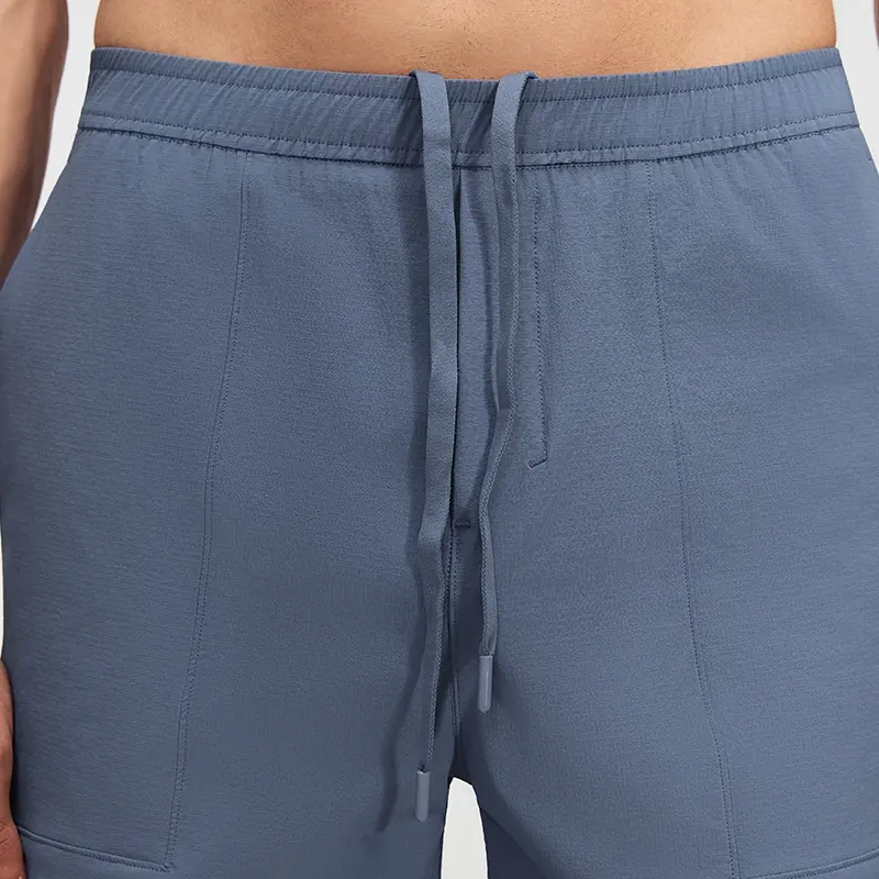 MZ-MS003 | Wholesale Men's Tech Casual Shorts: Water-Repellent 4-Way Stretch & Secure Zip Pocket - Washed Denim Blue - muzyoga 3 Detailed view of the internal adjustable drawstring on tech shorts.