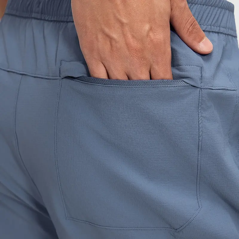 MZ-MS003 | Wholesale Men's Tech Casual Shorts: Water-Repellent 4-Way Stretch & Secure Zip Pocket - Washed Denim Blue - muzyoga 5 Detailed view of the secure back zipper pocket on MZ-MS003.