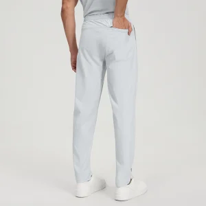 Back view of the pants featuring a rear zipper pocket and elastic waistband.