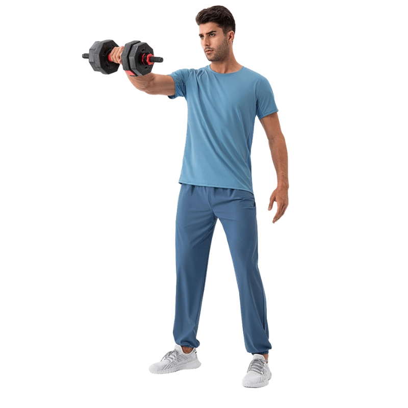 MZ-MWP004 | Wholesale Men's Cooling Quick-Dry Training Pants: High-Elastic 4-Way Stretch Joggers with Cuffed Ankle - Deep Blue - muzyoga 3 Man lifting dumbbells in a gym setting wearing Deep Blue joggers.