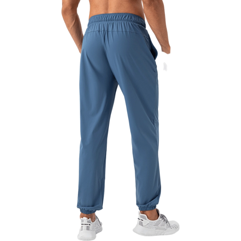 MZ-MWP004 | Wholesale Men's Cooling Quick-Dry Training Pants: High-Elastic 4-Way Stretch Joggers with Cuffed Ankle - Deep Blue - muzyoga 2 Back view of the MZ-MWP004 showing the contoured fit and elastic cuffs.