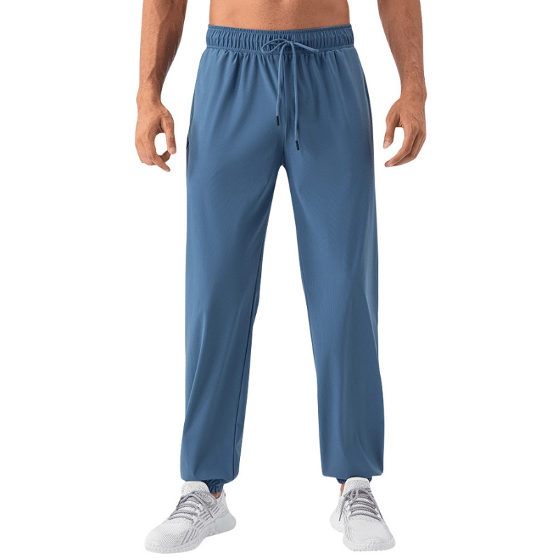 MZ-MWP004 | Wholesale Men's Cooling Quick-Dry Training Pants: High-Elastic 4-Way Stretch Joggers with Cuffed Ankle - Deep Blue - muzyoga 1 Front profile of men's Deep Blue high-elastic cooling joggers on a white background.