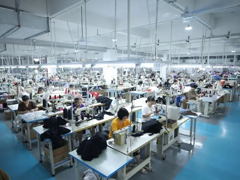 Professional sports clothing manufacturers production workshop at Muzyoga factory, executing low MOQ activewear bulk orders for global fitness brands.