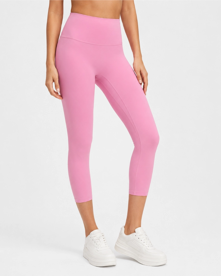 Pink 7/8 leggings showing cropped inseam length for yoga and Pilates