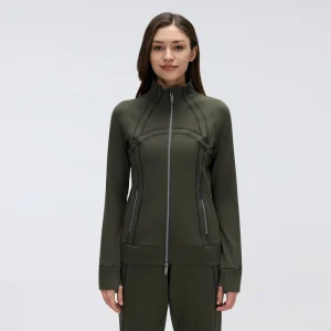 Front view of women's full zip workout jacket in Olive Green, featuring a stand collar, two-way zipper, curved contrast stitching and zippered pockets.