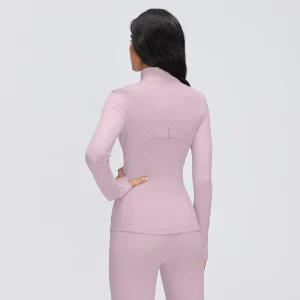 Rear view of a Porcelain Pink fitted workout jacket showing the curved upper-back seam, vertical panel stitching and long sleeves.