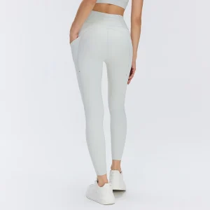 Rear three-quarter view of Steam Gray women's high-waisted leggings showing the curved back seams, fitted silhouette and side pocket construction.