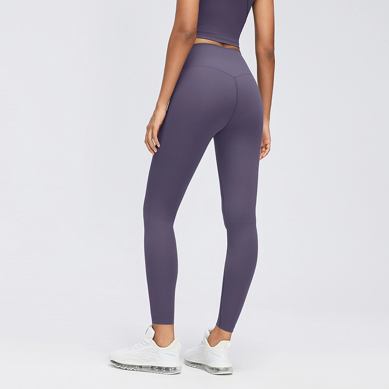Women's High-Waisted No-Front-Seam Yoga Leggings 2 Rear three-quarter view of Deep Purple high-waisted leggings showing curved back seams and a fitted leg shape.
