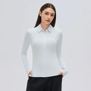 Front view of a women's Elegant Blue ribbed modal button-up long sleeve top with a shirt collar, fitted waist and full front closure.