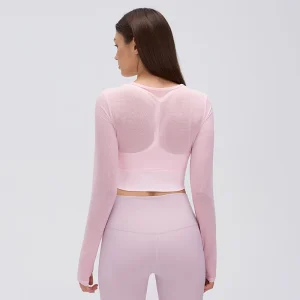 Rear view of a Pearl Pink long sleeve workout top showing the sheer mesh back and T-shaped inner bra straps visible underneath.