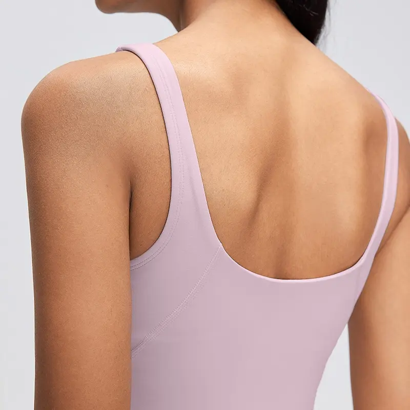 Women's V-Neck Longline Sports Bra with Scoop Back 4 Close-up of the low scoop-back neckline on a Porcelain Pink longline sports bra, showing the rounded back opening and wide straps.