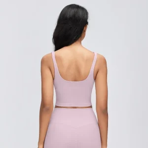 Rear view of a Porcelain Pink longline sports bra showing the low U-shaped scoop back, wide shoulder straps and straight cropped hem.
