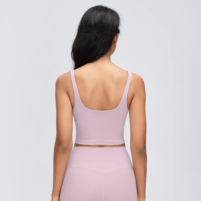 Women's V-Neck Longline Sports Bra with Scoop Back 2 Rear view of a Porcelain Pink longline sports bra showing the low U-shaped scoop back, wide shoulder straps and straight cropped hem.
