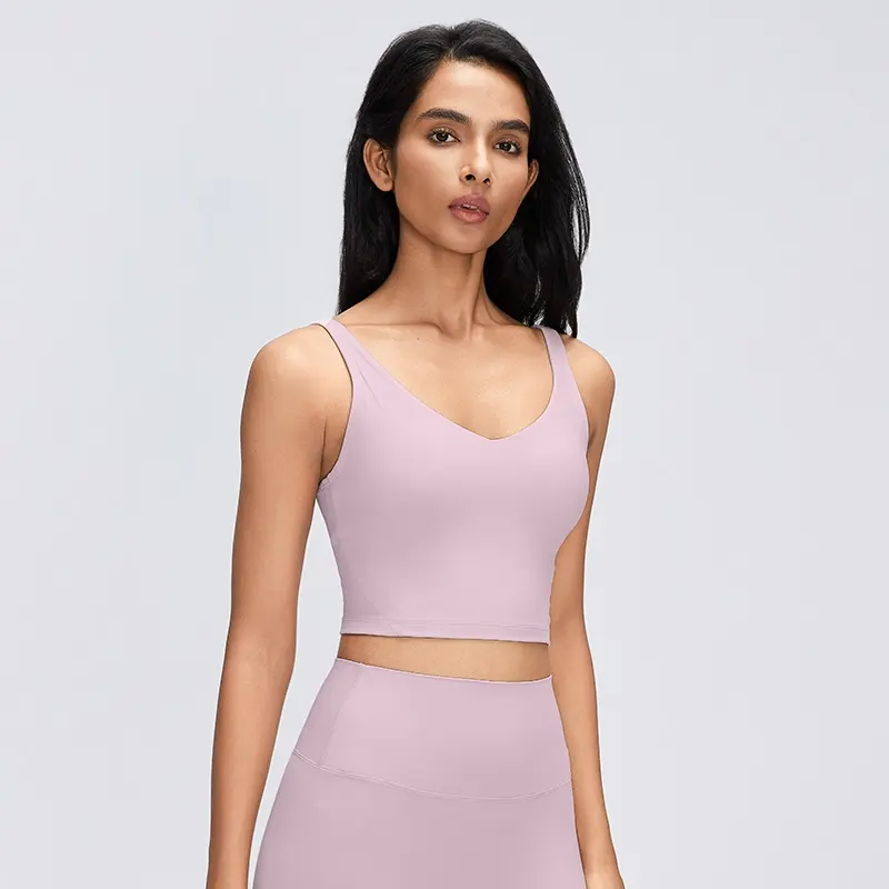 Women's V-Neck Longline Sports Bra with Scoop Back 1 Front view of a Porcelain Pink women's V-neck longline sports bra with wide shoulder straps and a fitted cropped hem.
