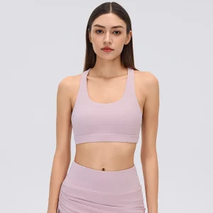 Front view of a Porcelain Pink women's scoop neck sports bra with wide elastic shoulder straps, smooth stretch fabric and a fitted underbust band.