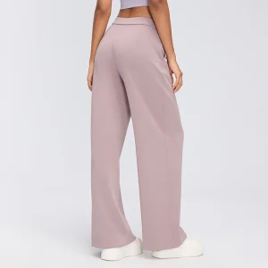 Rear three-quarter view of women's Smoky Pink wide-leg lounge pants showing the curved back seams and relaxed leg silhouette.