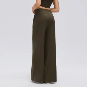Walnut Brown Wide-Leg Pants – Rear View Rear three-quarter view of Walnut Brown wide-leg pants showing the gathered elastic waistband, curved back seam and relaxed leg fit.
